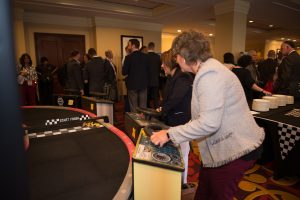 In addition to numerous networking and educational opportunities for the nearly 400 Symposum attendees, some folks had the chance to enjoy some of the day’s race-themed events, including this electronic race car challenge. Here, employer-members Carrie Rust from Ellwood Group, Inc., and Lisa Harris, from the Eat’n Park Hospitality Group, Inc., compete.